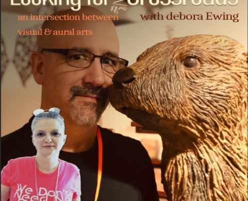 Tony Furtado and Bill the Otter, who is a wood sculpture.