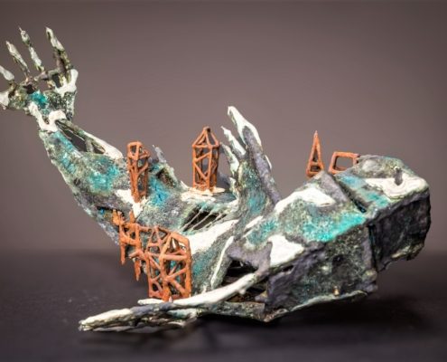 ceramic sculpture of a fish dying of city-viruses