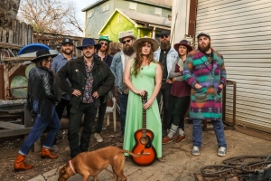 may be several people, a guitar, and a dog