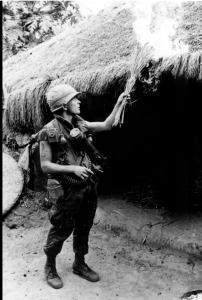 US soldier sets a "hooch"-- thatched home-- ablaze at My Lai. Photo: Wikiimedia Commons