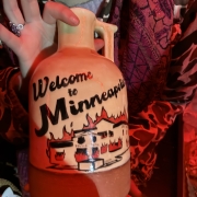 clay jug which says "welcome to Minnesota" - there's moonshine inside, in fact.