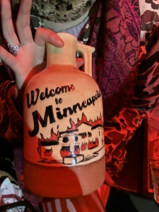 clay jug which says "welcome to Minnesota" - there's moonshine inside, in fact.