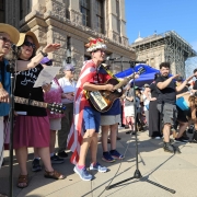 women protestors with guitars